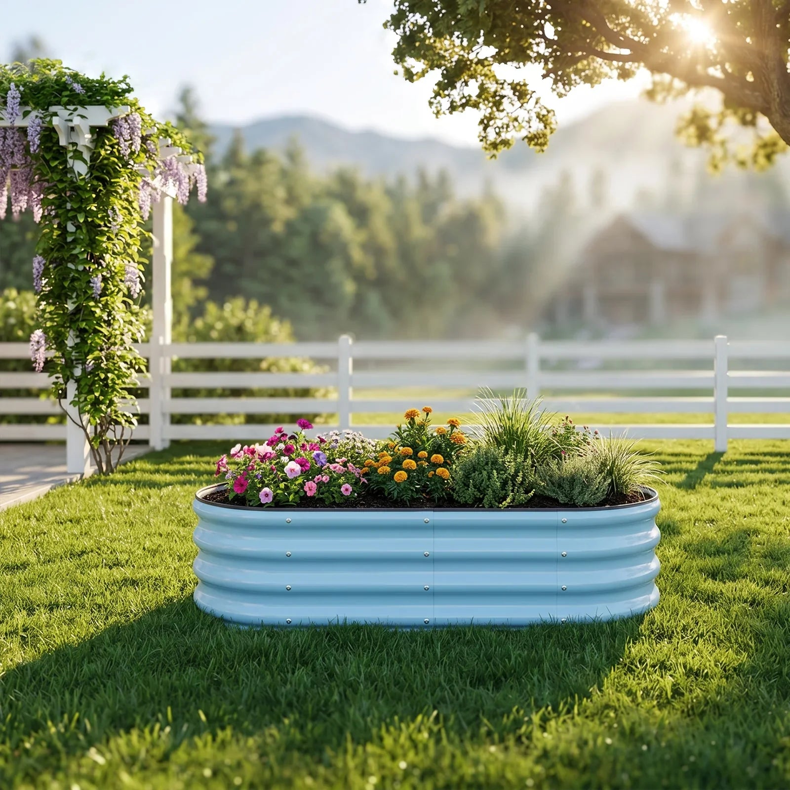 Blue metal raised garden bed with colorful flowers on sunny lawn near white fence