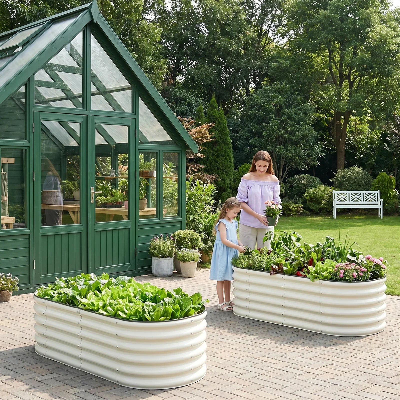 Metal raised garden beds with lush greens and flowers, perfect for backyard gardening near a greenhouse.